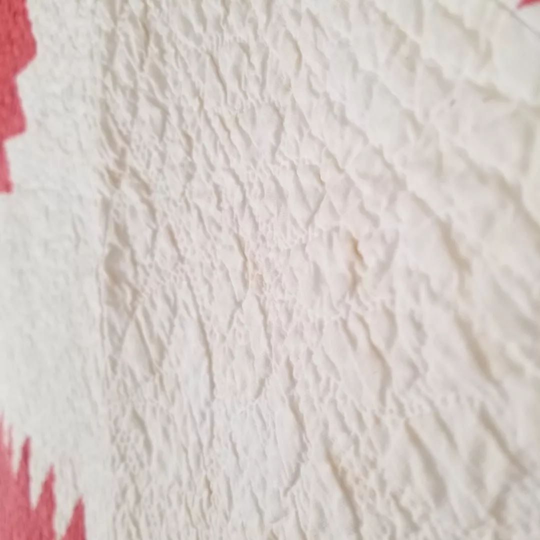 Red and White Sawtooth Quilt