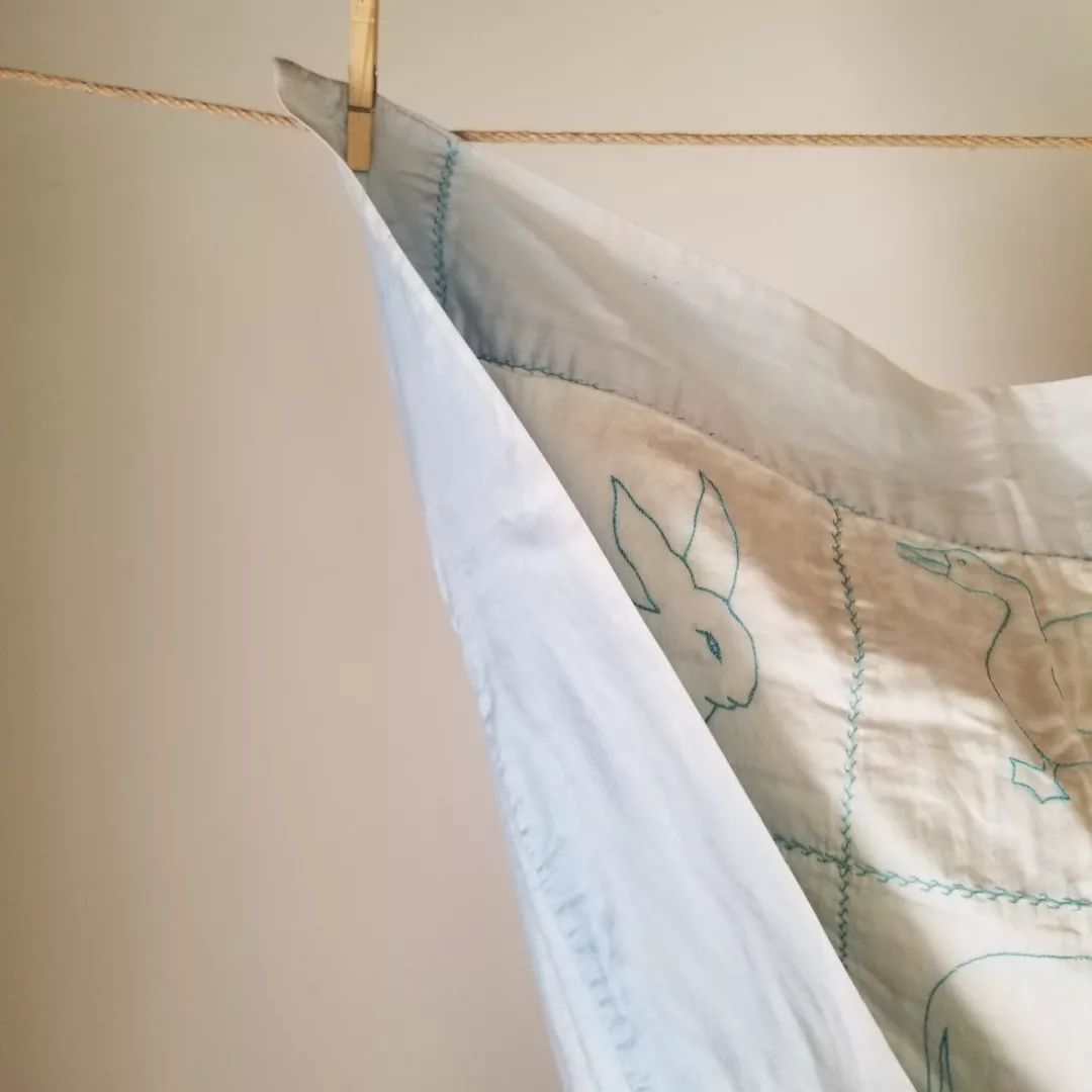 Embroidered Satin Baby Quilt