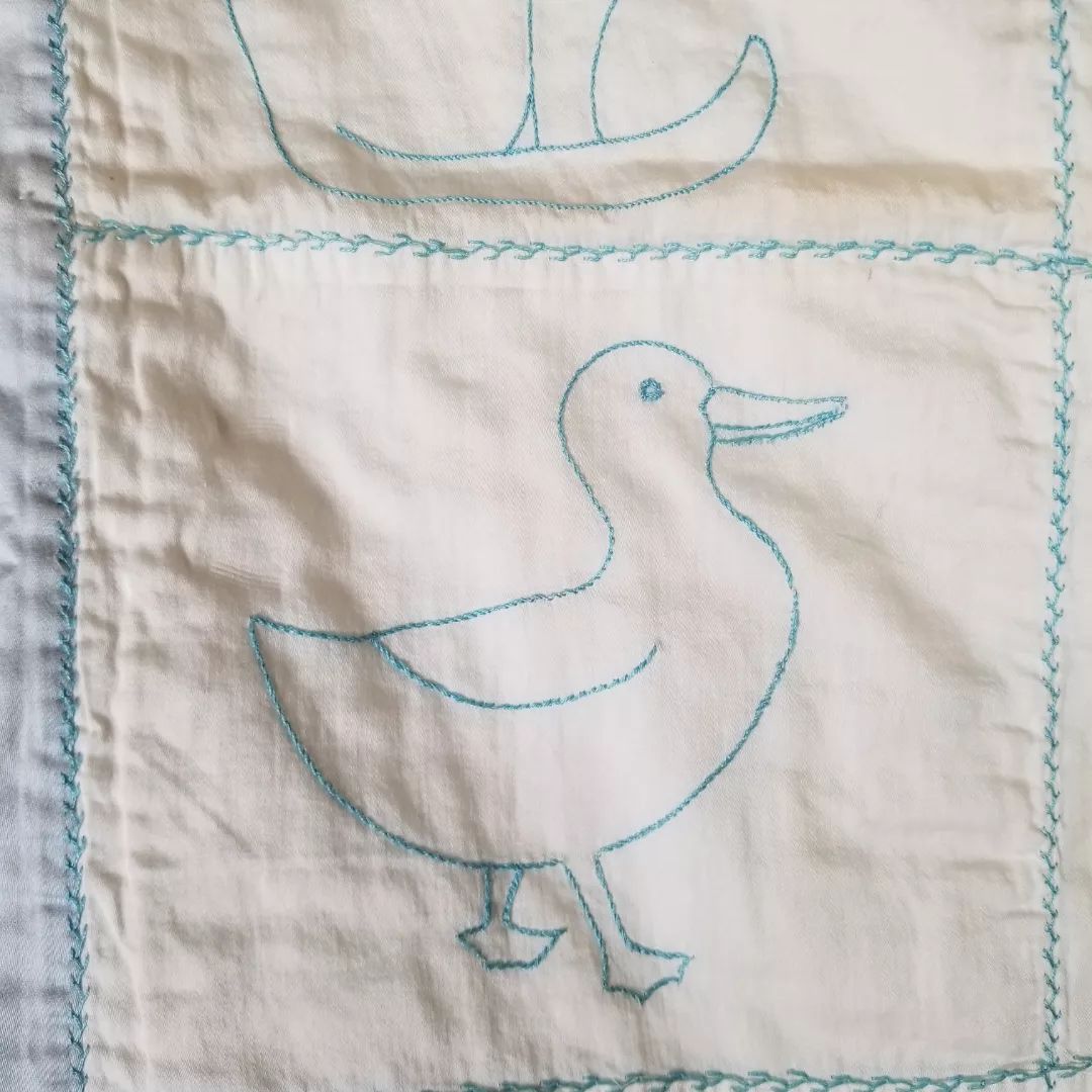Embroidered Satin Baby Quilt